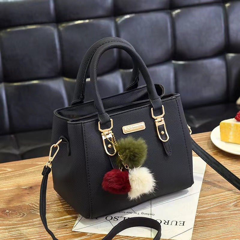 Elegant Pink Handbag with Pom Pom Charm