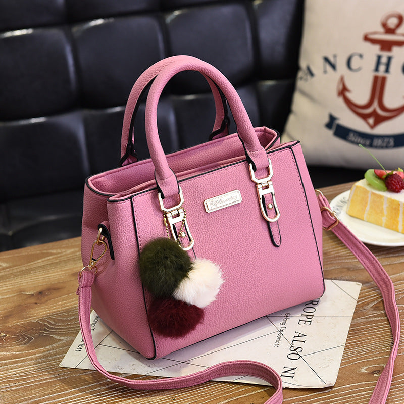 Elegant Pink Handbag with Pom Pom Charm