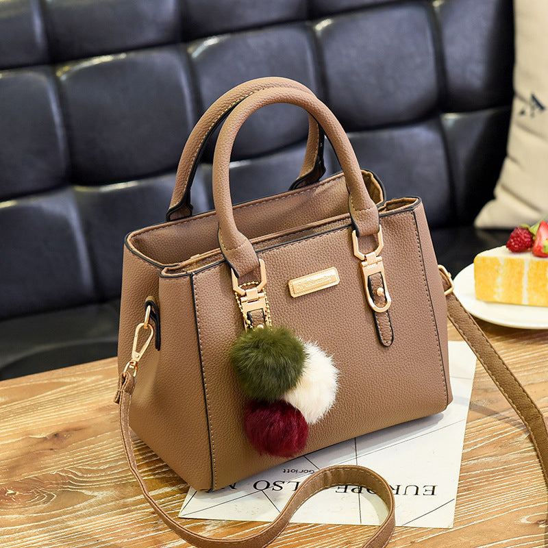 Elegant Pink Handbag with Pom Pom Charm