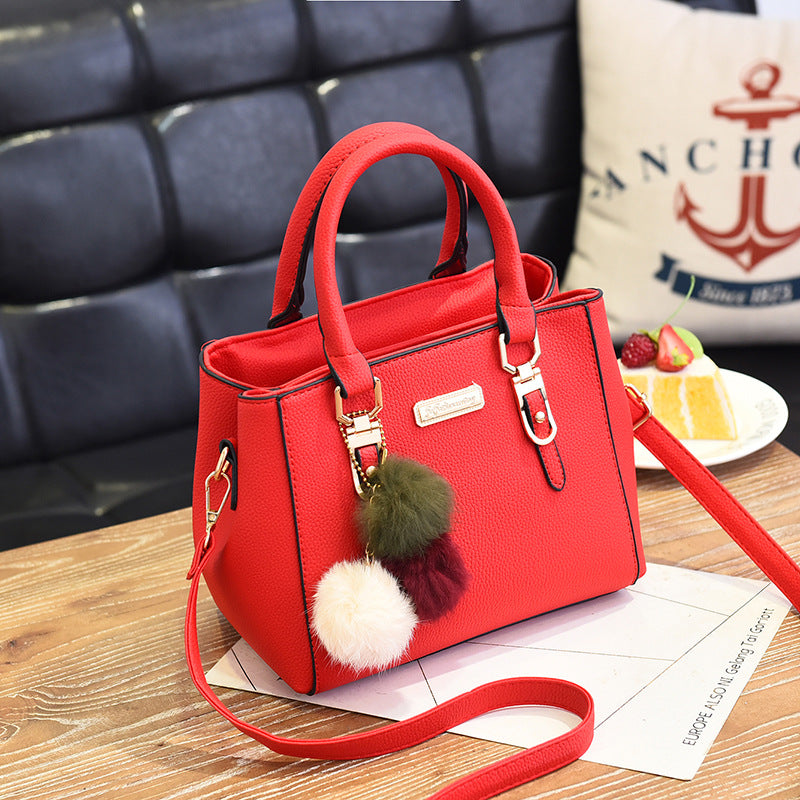 Elegant Pink Handbag with Pom Pom Charm